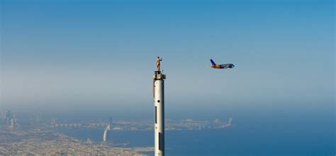 Emirates Viral Ad With Woman Standing On Top Of Burj Khalifa, And An ...