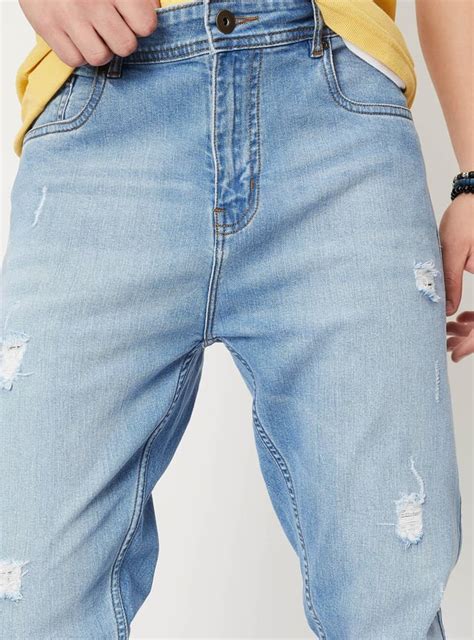 Buy Men Distressed Carrot Fit Jeans Online at just Rs. 1699.0 ...