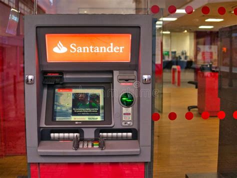 A man walks past an automated teller machine (ATM) outside Bank of America Corp. headquarters in Cha