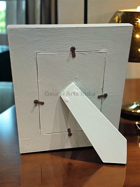 Hand-painted wooden photo frame adds a warm, artistic touch to your ch ...