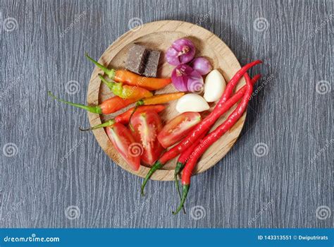 Ingredients of Hot and Spicy Sambal Chili Paste Placed on Wooden Plate ...