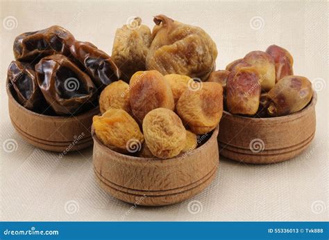 Dried Figs, Dates, Dried Apricots in a Wooden Circular Shape Stock ...