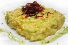 ricetta per risotto ai fiori di zucca risotto ai fiori di zucca con speck croccante gradara ricetta per risotto ai fiori di zucca risotto ai fiori di zucca con speck croccante gradara