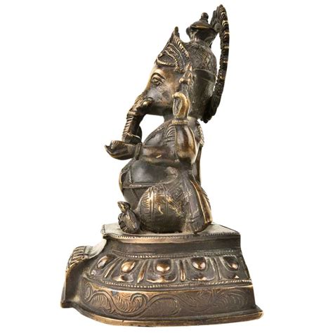 Brass Lord Ganesha Seated On A Raised Lotus Seat