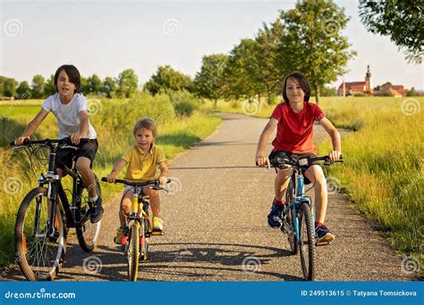 Cute Happy Children, Brothers, Riding Bikes in the Park on a Sunny ...