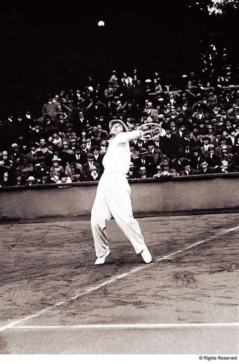 Download René Lacoste gracefully performing an overhead tennis shot ...
