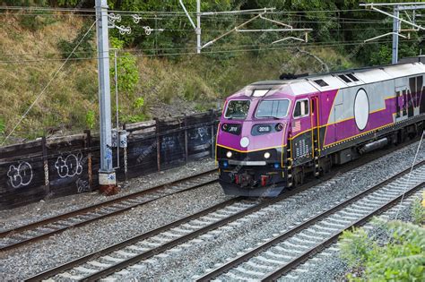 Premium Photo | Railroad tracks and a train represent journey ...