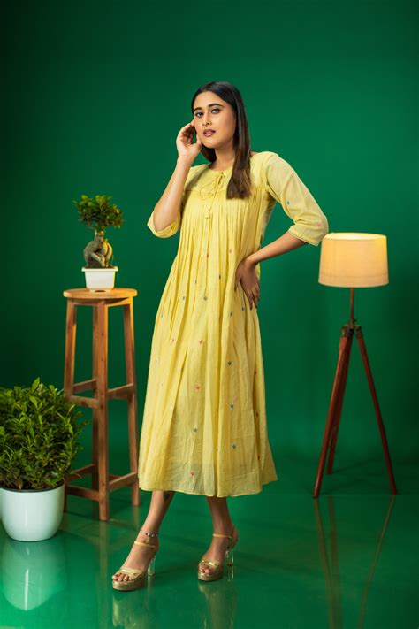 Yellow shaded pure soft mul cotton dress/kurti with multi colour threa ...