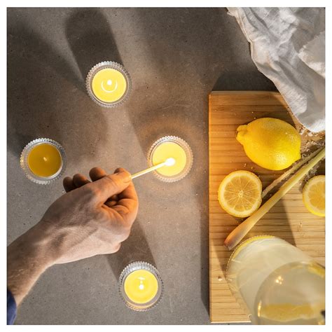 BLODHÄGG scented tealight, lemon & lemongrass/yellow, 3.5 hr - IKEA