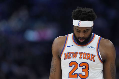 What nationality is Mitchell Robinson?