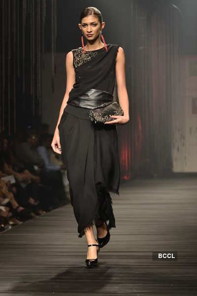 A model showcases a creation by designer Tarun Tahiliani on Day 1 of ...