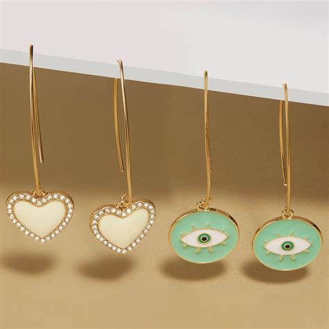 Buy Zaveri Pearls Set Of 2 White & Turquoise Blue Evil Eye Heart Drop ...