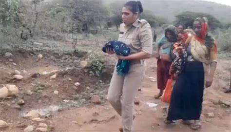 Caught On Cam: Lady Cop In Gujarat Carries 4-Day-Old Child To Safety As ...