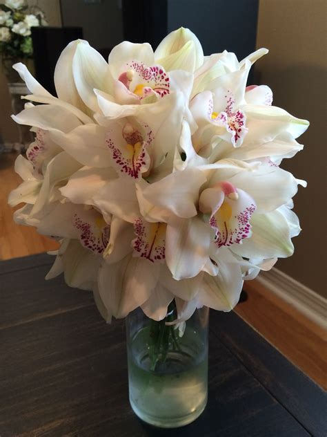 White Cymbidium Orchid Bouquet | Orchid bouquet wedding, Orchid bridal ...