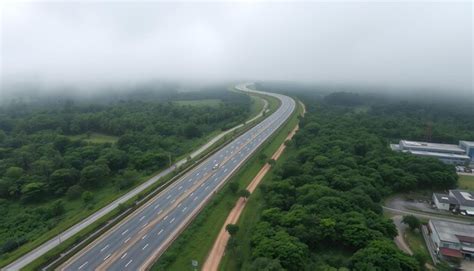 Aerial footage of the highway during the monsoon season with lush green ...
