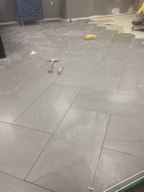 The herringbone pattern typically found with hardwood installations is ...