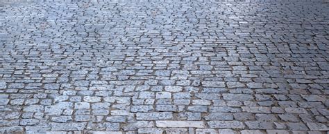 Stone paved footpath cobblestone pathway background texture | Premium Photo