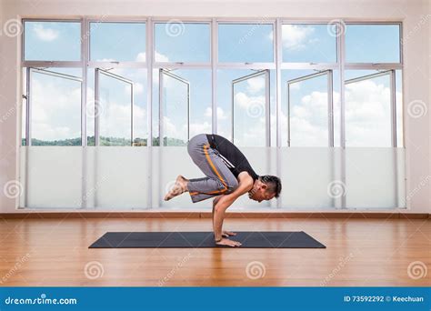 Yoga Practitioner Performing Crane or Crow Pose or Bakasana Pose Stock ...
