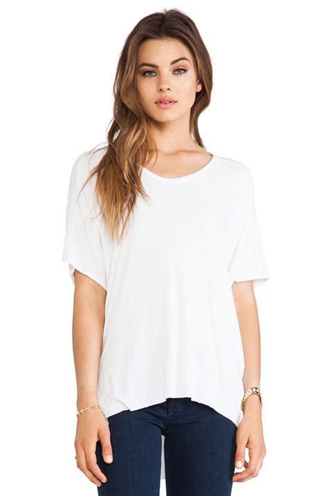 dolan Short Sleeve High Low Tee in White | REVOLVE