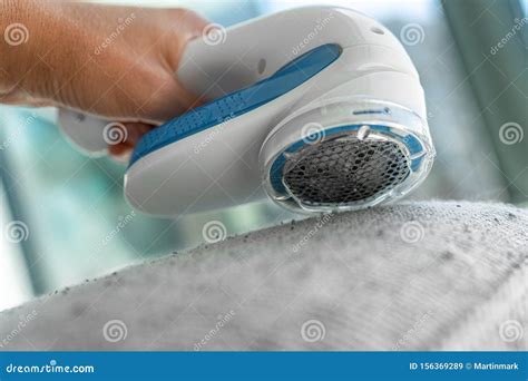 Fabric Shaver Fuzz Remover Woman Removing Lint on Fabric Sofa Furniture ...
