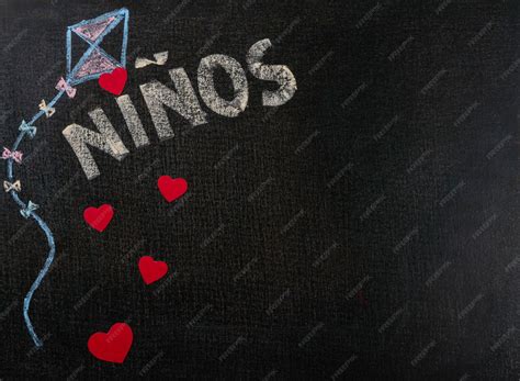 Premium Photo | Drawing on sandpaper. niños (spanish) written on ...