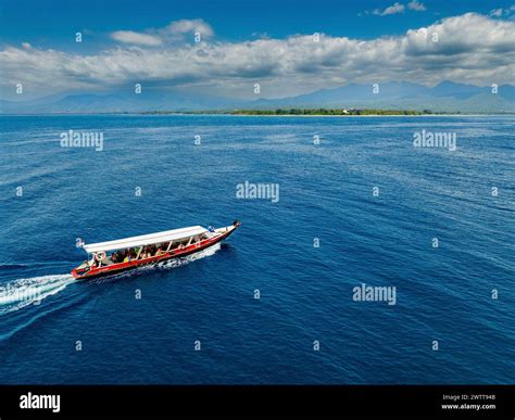 Aerial view of a passenger boat travelling to GILI AIR - a tropical ...