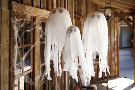 Easy to copy these pottery barn hanging ghosts. | Halloween ghost ...