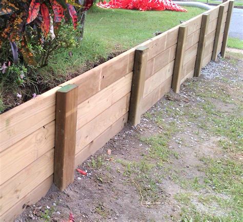 Build an Easy DIY Wood Retaining Wall (With images) | Landscaping ...
