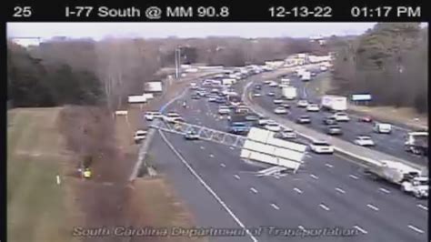 Traffic backup on I-77 after sign falls on highway by Carowinds | wcnc.com