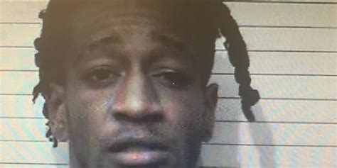 Hugo man charged with setting fire to home with someone inside