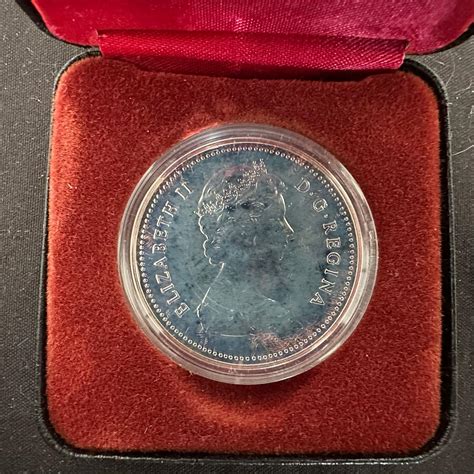 Lot - Canada, 1980 Silver Dollar in RC MInt case, with a special ...