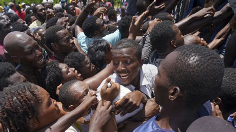 Haitian Quake Victims Rush Aid Sites And Take Food And Supplies : NPR