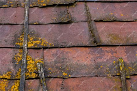 Premium Photo | Rusted sheet metal roof with wooden planks mold and dirt