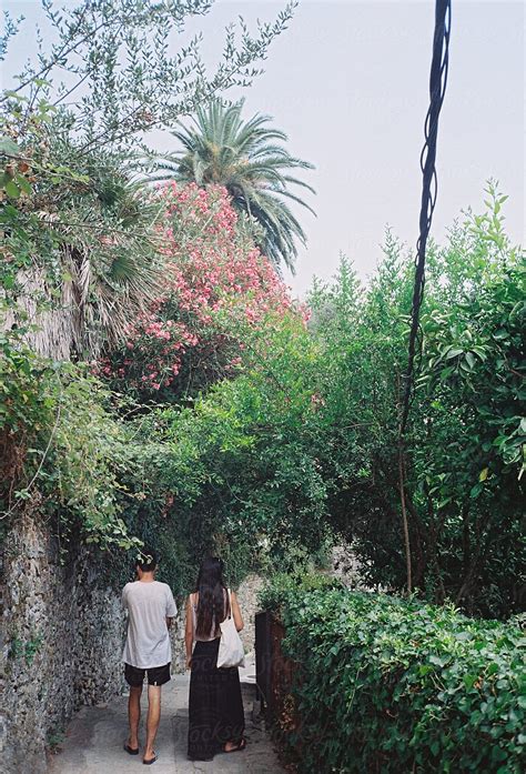 "Couple And Plants On A Hot Summer Day" by Stocksy Contributor "Marija Mandic" - Stocksy