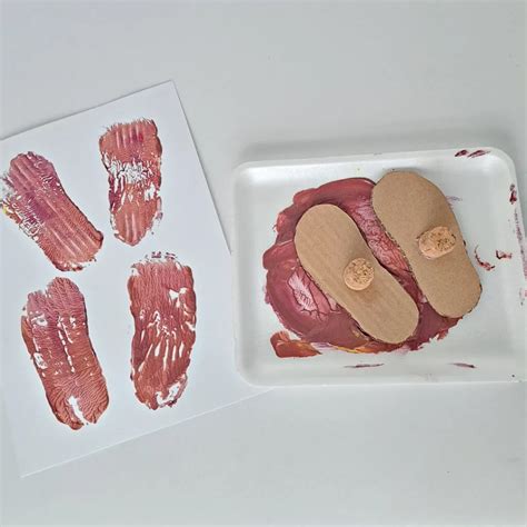 Muddy Footprints Toddler Painting - My Bored Toddler