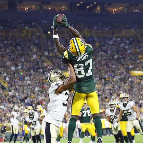 Download Romeo Doubs Catching Football Wallpaper | Wallpapers.com