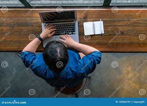 Top view of laptop and coffee mug on work desk