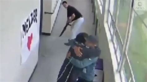 Brave High School football coach stops ‘mass shooting’ by hugging ...