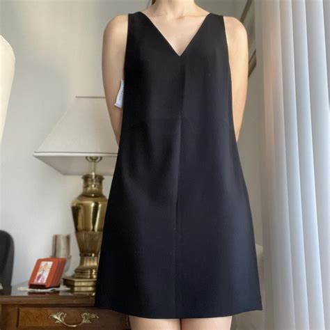 Black Aritzia mini length A-line dress. Never worn,... - Depop