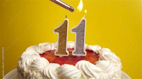 A candle in the form of the number 11, inserted into the holiday cake ...