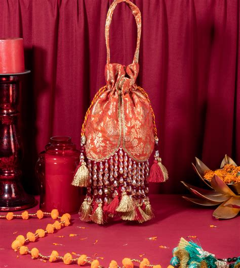 Orange Meera Tasseled Potli – Suave Bags