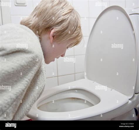 Young boy with stomach flu vomiting in tolilet Stock Photo - Alamy