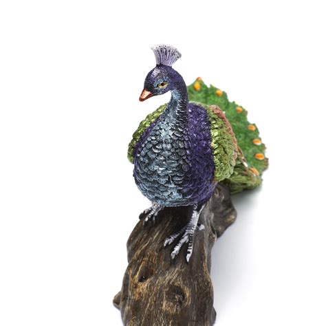 Buy Galaxy Peacock on Log from Home Centre at just INR 1799.0