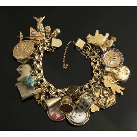 14k Gold Charm Bracelet | Witherell's Auction House