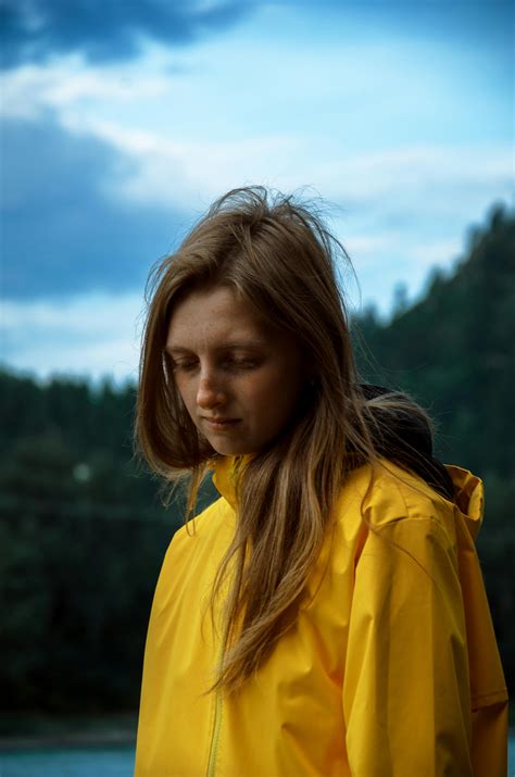 Blonde Woman in Yellow Raincoat with Hood · Free Stock Photo