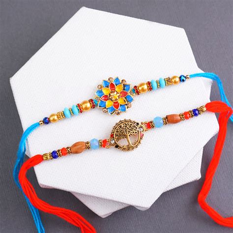 Send Golden Rakhi N Flower Rakhi with Sweets Combo Online | Rakhibazaar.com