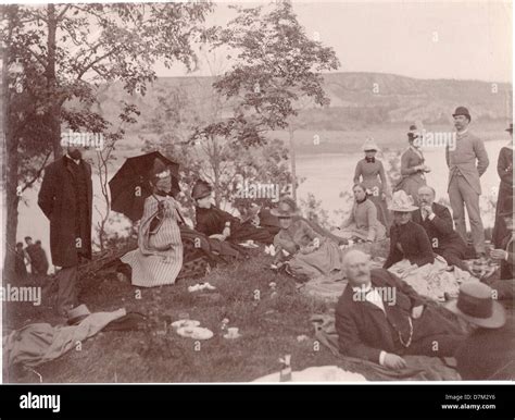 This image shows a group of people enjoying a picnic in Lysekil, Sweden, capturing everyday life ...