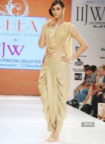 A model walks the ramp during Rhea Nasta's show on Day 3 of India ...