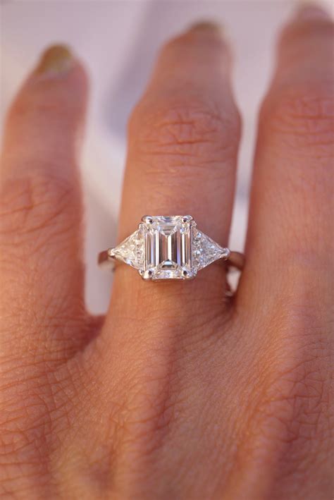 emerald cut engagement rings with side stones