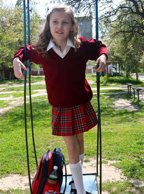 Download School Girl Red Sweater Skirt Picture | Wallpapers.com